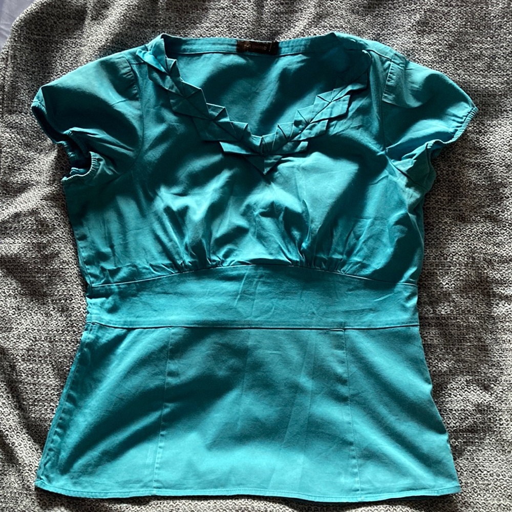 The limited teal women’s dress top